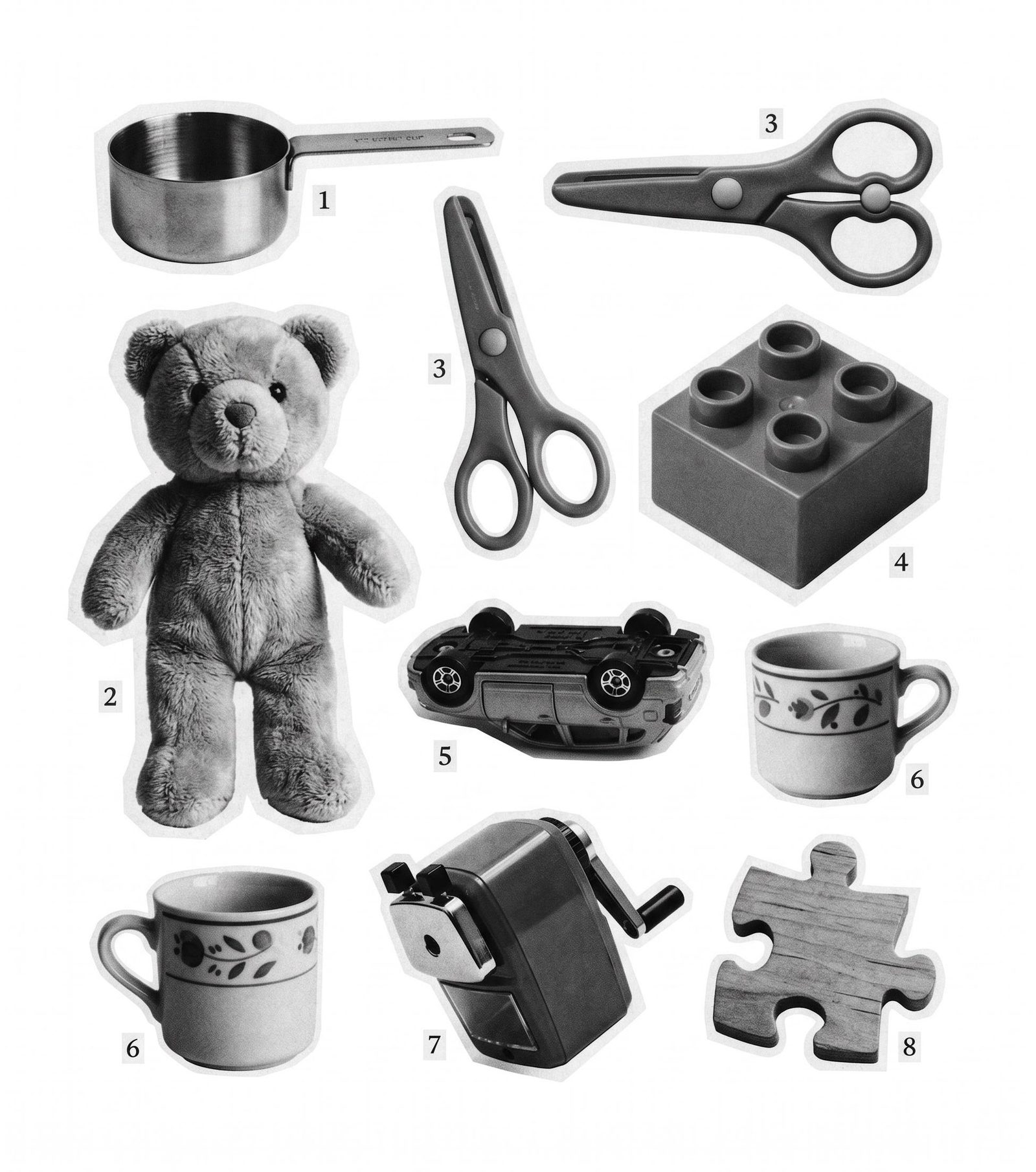 Monochrome concept sheet of toys and everyday objects, including a teddy bear, scissors, cups and a toy car.