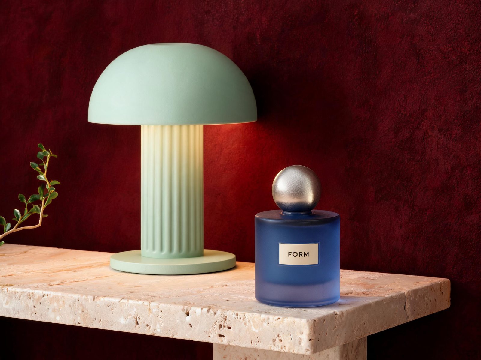Cobalt FORM perfume bottle and mint-green lamp composed from two reference images using Seedream 5.0 Lite Edit.