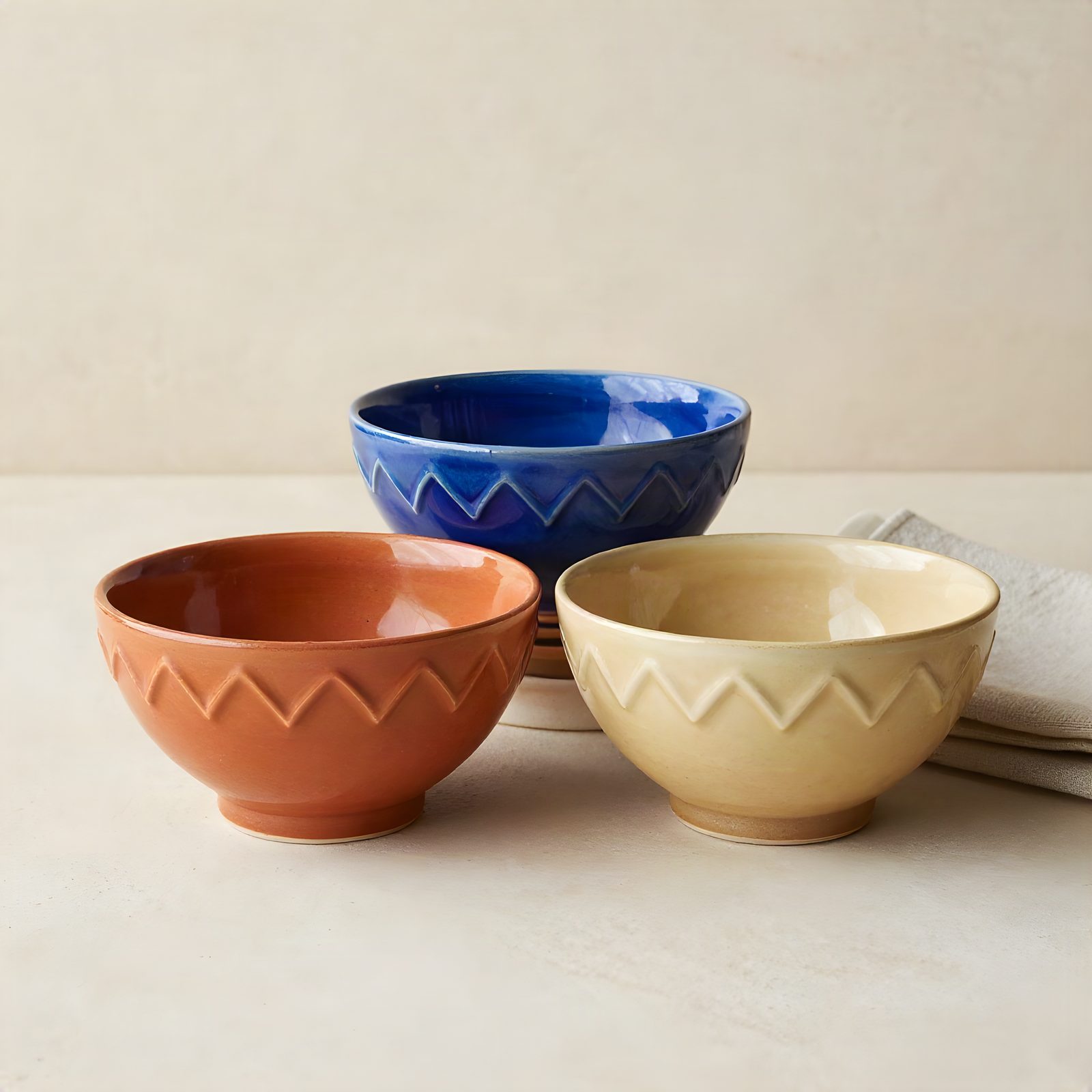 Compact arrangement of blue, terracotta and cream ceramic bowls, upscaled four times by ESRGAN.