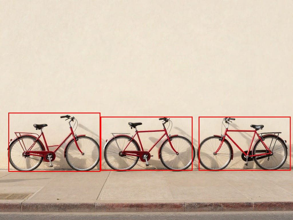 Three red bicycles localized by actual Moondream Detection bounding boxes.