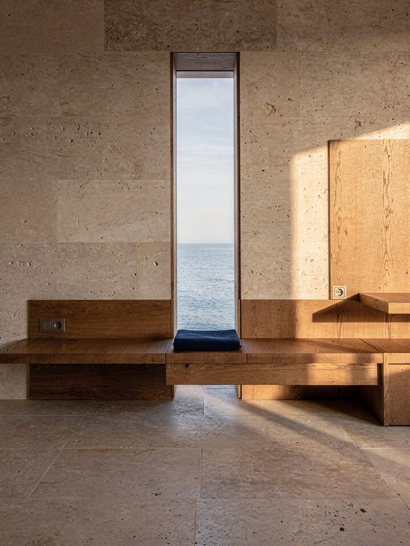 Limestone and pickled-oak interior with a built-in bench and sea view, generated with FLUX.2 Pro
