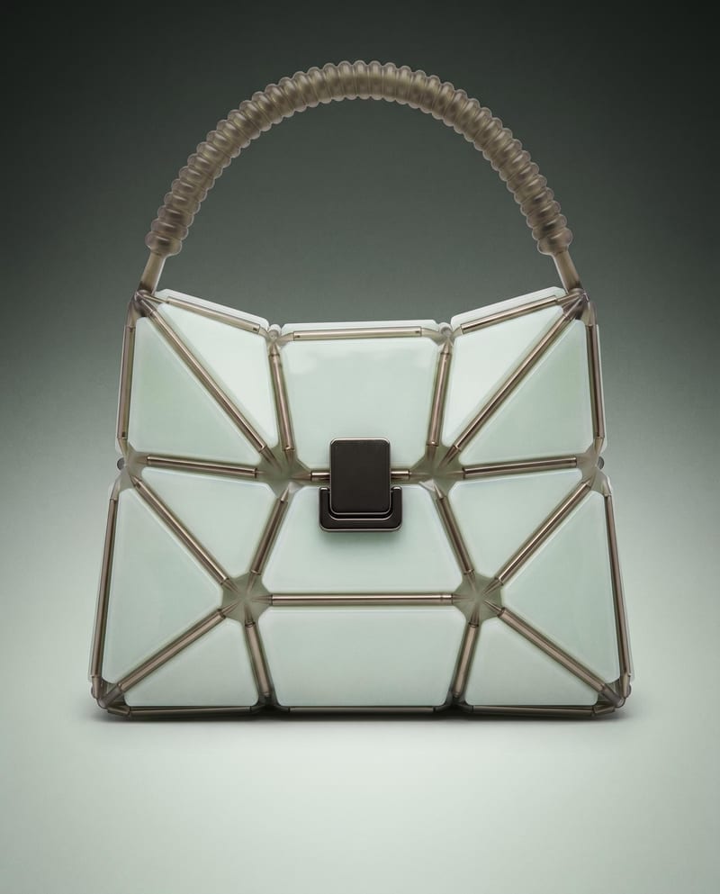 A pale geometric handbag with metallic framing, shown in the Professional Product Campaign recipe.