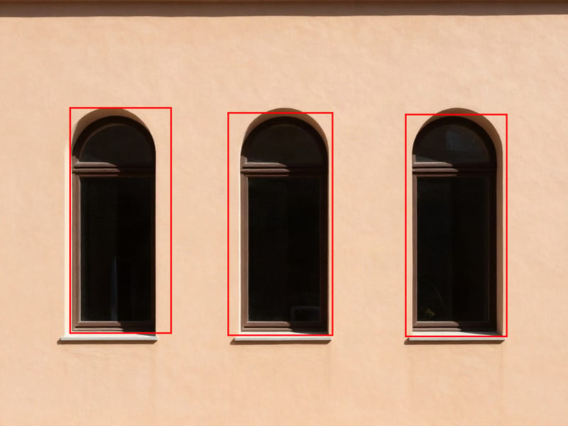 Moondream Detection bounding boxes around three separate arched windows.